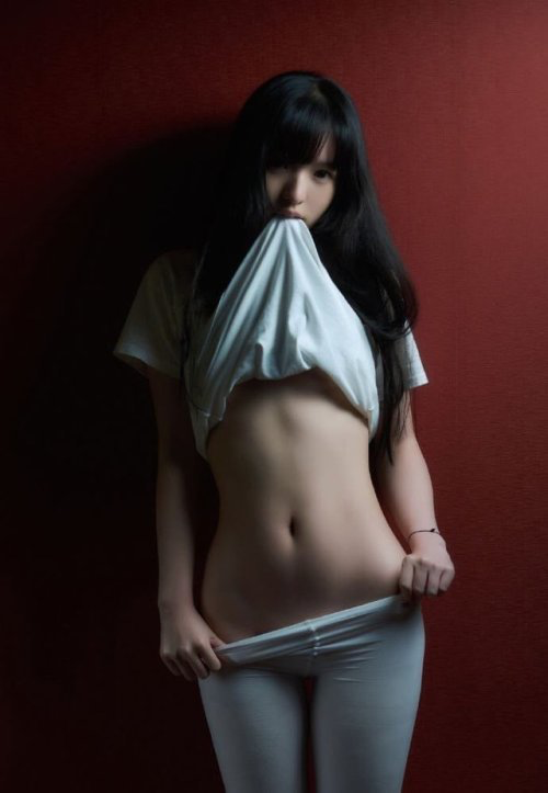 Beautiful Asian woman undresses