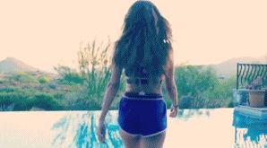 Selena jumps in a pool