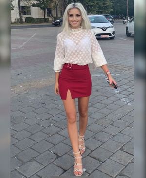 Blonde leggy chick in mini dress and sheer top