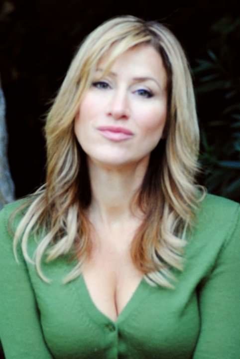 Hot blonde with MILF cleavage.