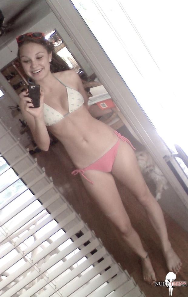 Teen in swimsuit about to get naked
