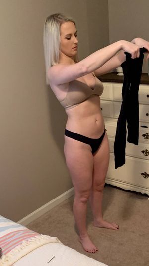 Just a sexy gal getting dressed for work