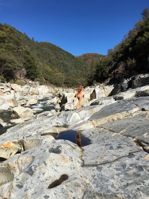 nude hiking up a mountain river