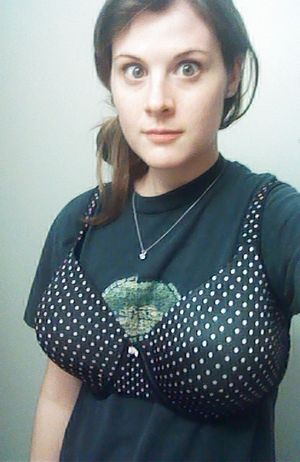 Poor flat-chested brunette wearing sister's bra