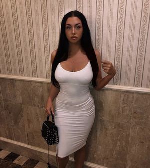 Meghans nipples show through her tight white dress