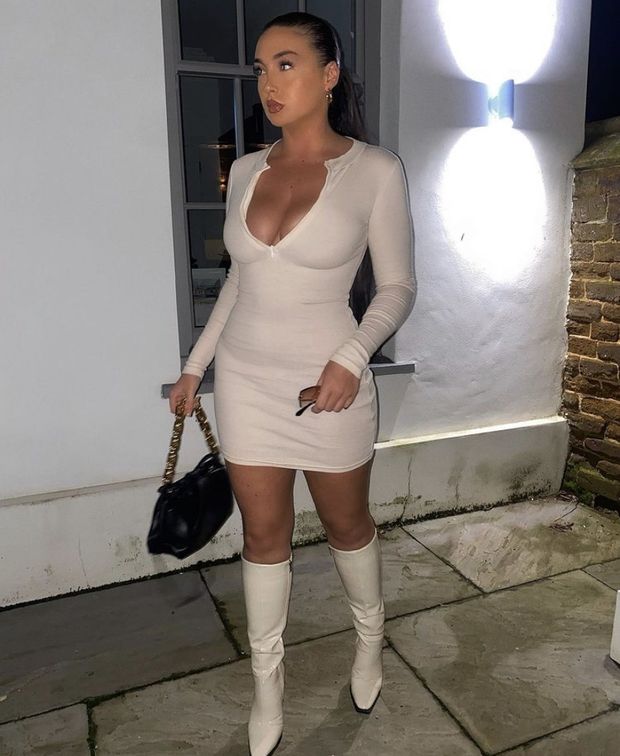 Knee high boots and a tight dress with big tits