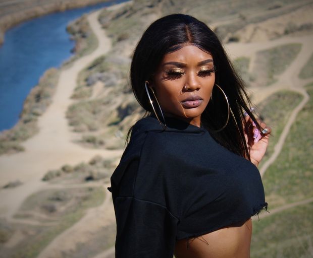 Sexy black woman wearing cut off shirt