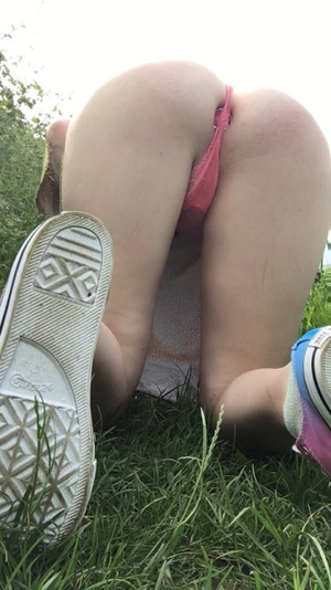 Slut reveals buttplug tucked away