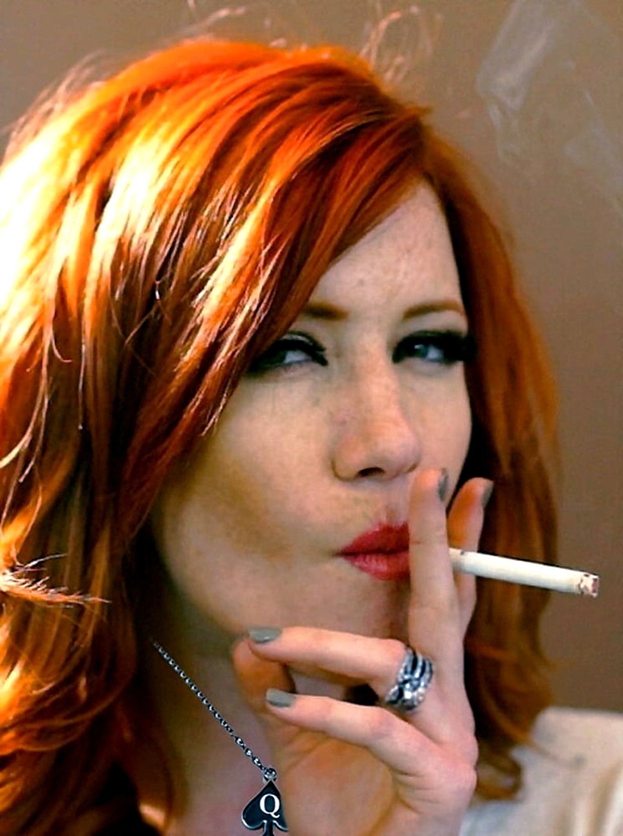 This natural redhead is having a smoke and also marked as a bbc queen!