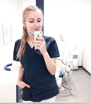 Cute blonde nurse in scrubs