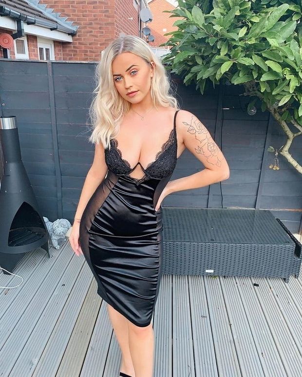 Blonde babe in sexy black dress