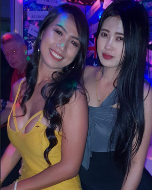 This photo of 2 bargirls & an aged man with vampiric eyes behind them could not be better framed or composed. Chilling.