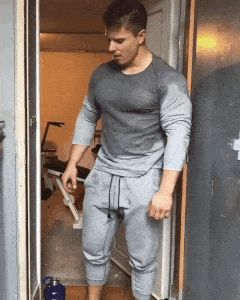 Ripped hunk takes off shirt