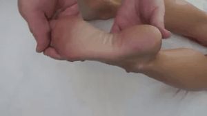 Goldie Blair feet on bed