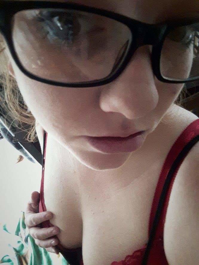 Slutty nerd grabbing tits in bra