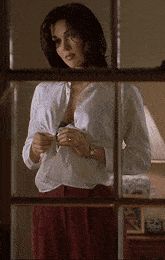 Disrobing...Nice melons.