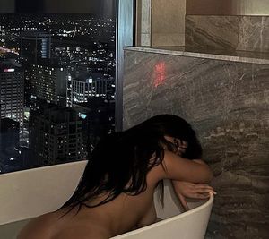 Asian naked in her bath