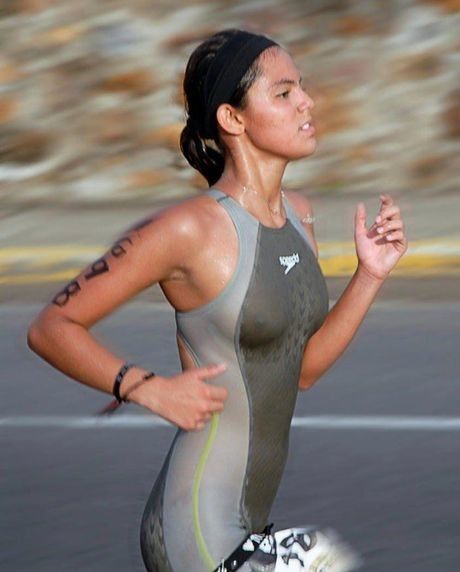 Skin tight suit on a running athletic gal
