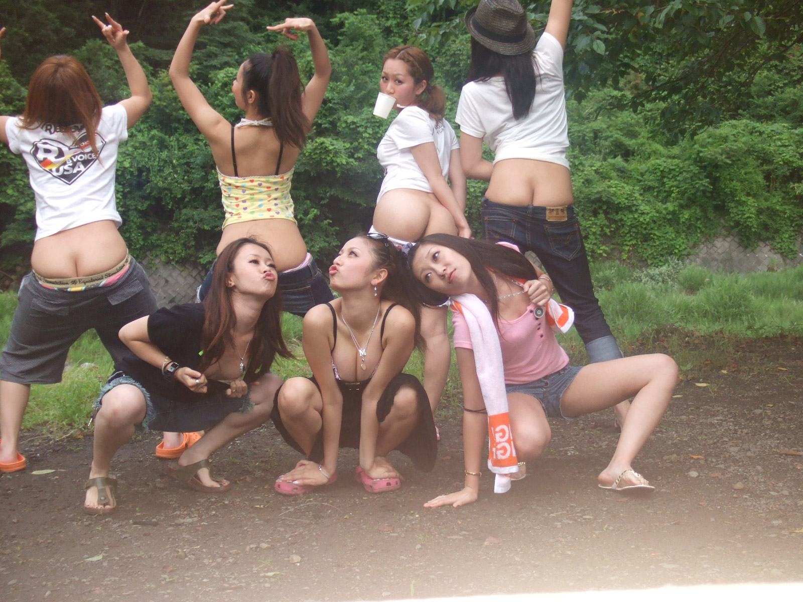 Cute asians flashing asses in the wild