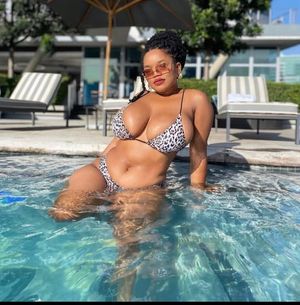 Jessica Mkhize lounging in the pool