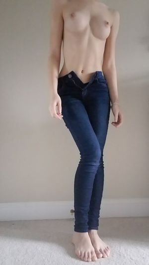 Skinny babe topless in jeans
