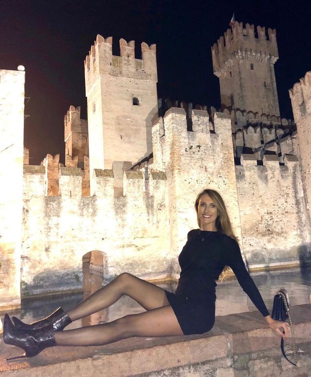 Leggy babe posing outdoors