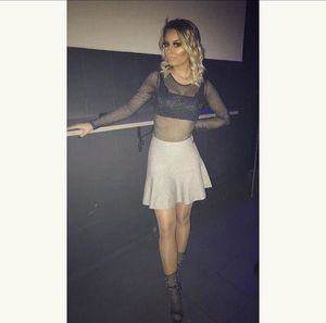 Blonde chick in mini skirt and sheer top