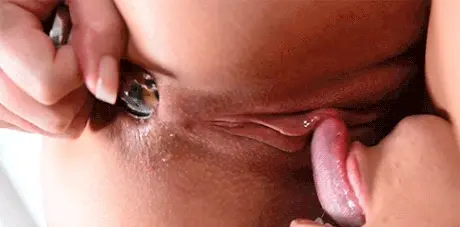 Lesbian licking with a buttplug