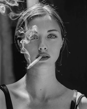 Beautiful Elvira smoking for the first time