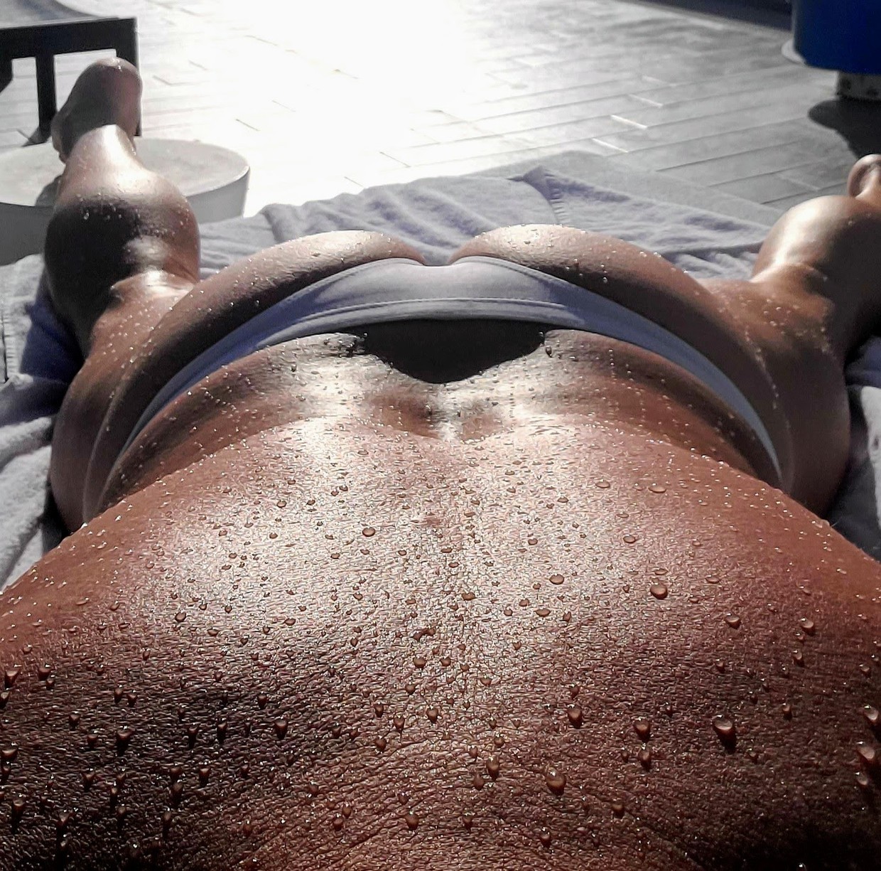 Thong tanning at the pool