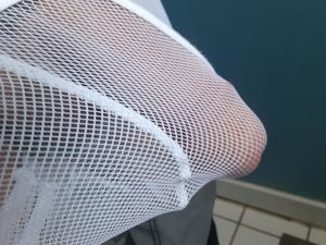 white mesh imprisoned cock straining to be free