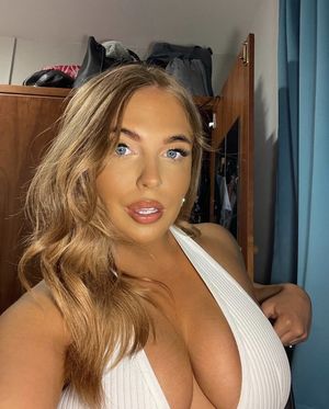 Slutty teen shows her massive cleavage