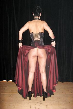 Female slave showing her ass for interested guests.