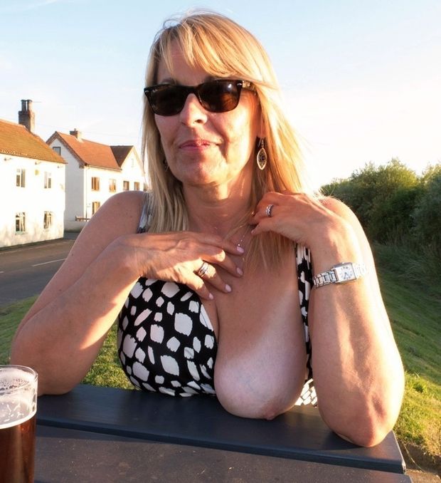 redhead mom flashes a boob