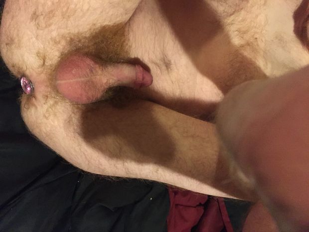 hairy man shows off buttplug