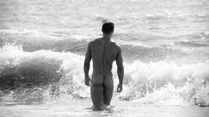 muscular-hunk-at-the-edge-of-the-ocean/