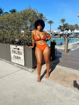 Nu-ski looking sexy in her Orange bikini