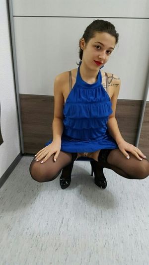 Very invitating panties of cute petite brunette in blue mini dress