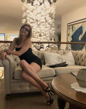 Cute blonde amateur posing in glasses and strapless lbd