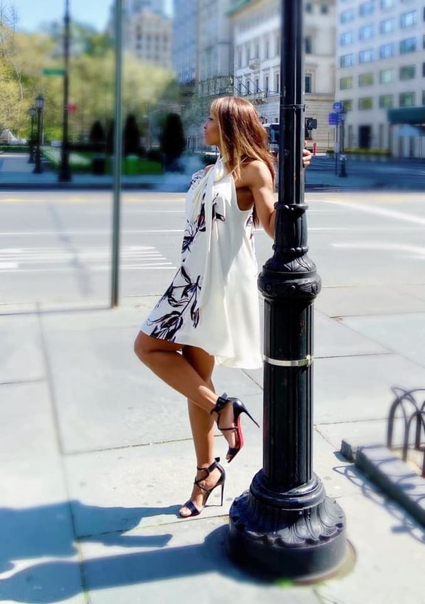 Hottie posing outdoors in fancy mini dress and sandals