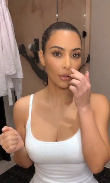 No, she's not picking her nose.