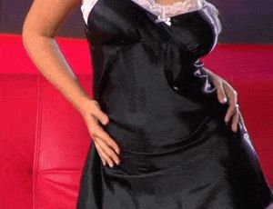 Erica Campbell - Black dress on Red Couch