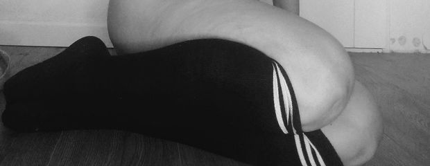 Keeping my legs warm wearing black high knees socks..
