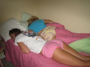 Two teens sleeping in one bed