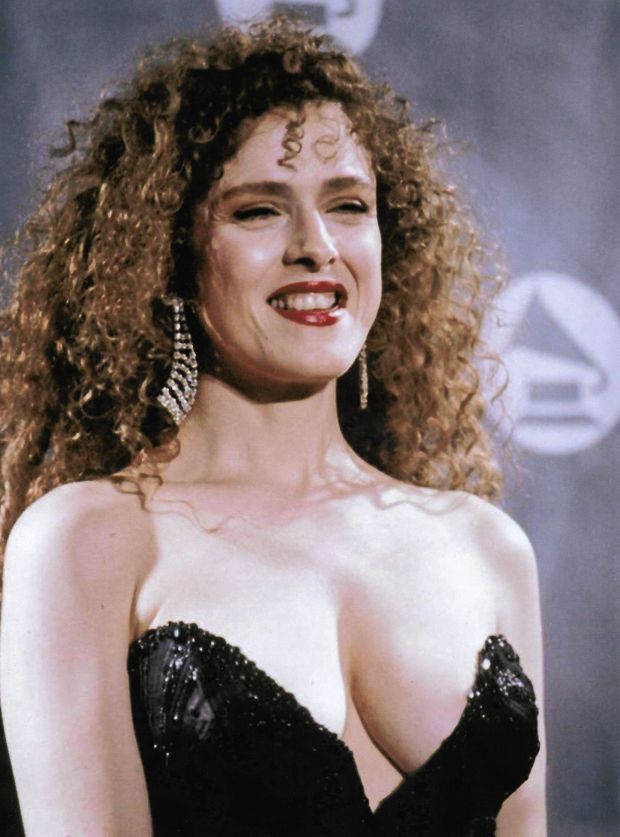 She spots an admirer. With cleavage like that, it's easy to stare.