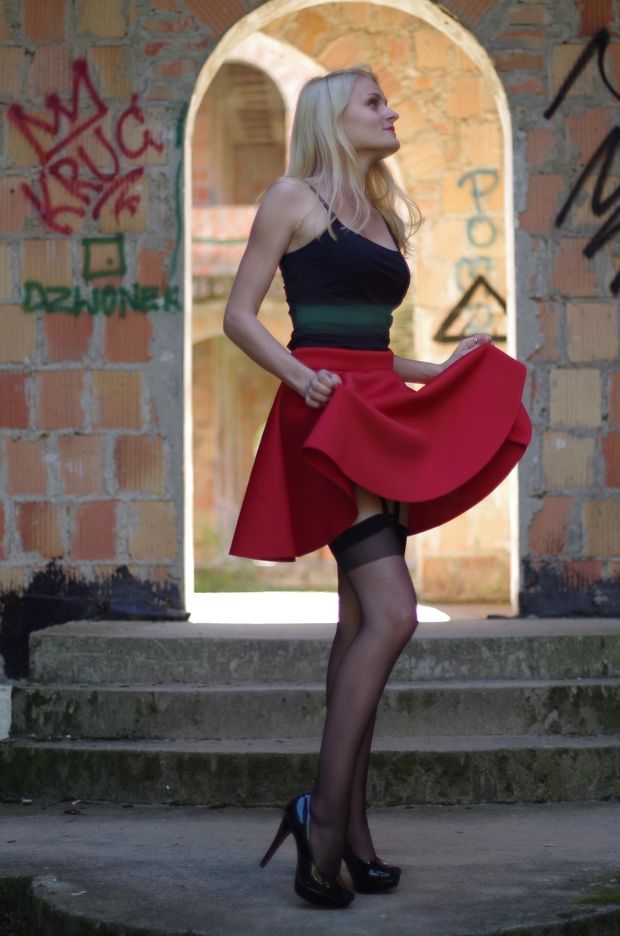 Blonde lifting up her red skirt