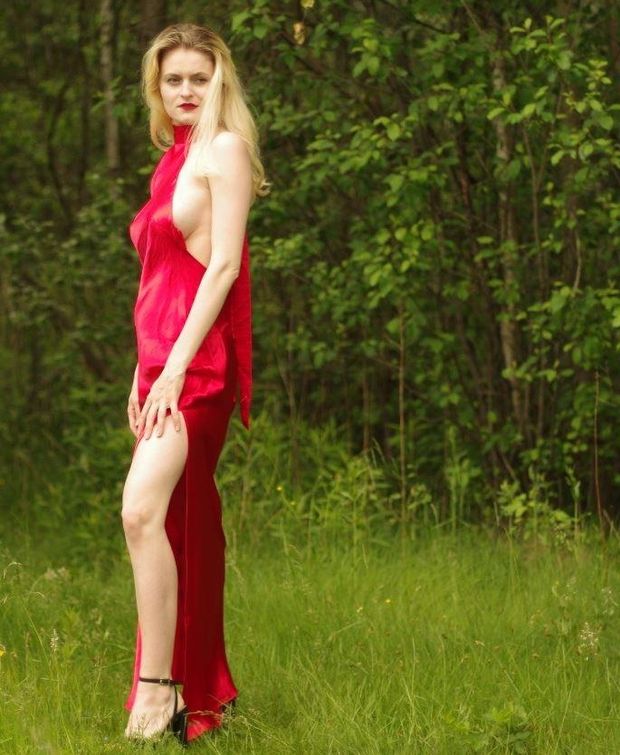 Gorgeous blonde babe exposing her amazing body in shiny smooth silky red dress