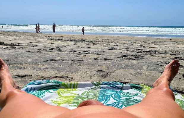 Getting some naked tanning at the beach