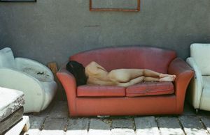 Naked nap on messy couch
