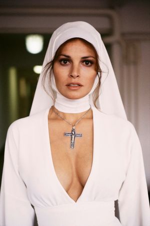 A sexy nun appears. Too beautiful for words.